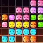 Caras sonrientes y coloridas de bloques en una cuadrícula de fondo negro