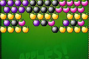 Frutas de colores morado, negro y amarillo organizadas en filas sobre un fondo verde