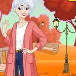 Persona de cabello blanco y corto sonriendo, con un abrigo rosa y pantalones azules, en un parque otoñal con árboles rojos y bancos de madera