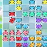 Gato rojo dibujado sobre un tablero lleno de figuras de animales coloridos como osos azules, pollitos amarillos, pulpos verdes, conejos rosas y gatos naranjas
