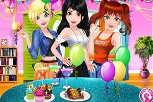 Tres chicas animadas celebrando en una fiesta con globos y comida sobre una mesa en un ambiente festivo
