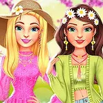 Dos chicas jóvenes, una rubia con sombrero beige y la otra con cabello oscuro y corona de flores, vestidas con atuendos primaverales en un entorno floral