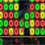 Bloques de colores rojo, verde y amarillo con espirales sobre un fondo oscuro