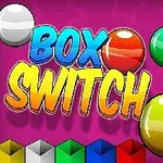 Texto Box Switch en colores vibrantes con esferas de diversos colores sobre fondo rosa