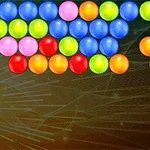 Bolas de colores brillantes alineadas en filas sobre un fondo oscuro con patrones de líneas