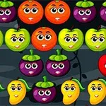 Frutas con caras sonrientes en filas ordenadas sobre un fondo oscuro