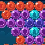 Burbujas de colores naranja, morado y azul agrupadas sobre un fondo oscuro