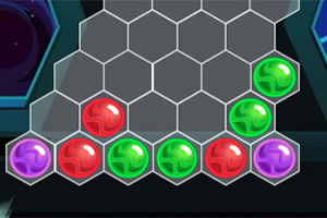 Esferas de colores rojo, verde y morado dispuestas en una cuadrícula hexagonal