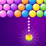 Fila de burbujas de colores en la parte superior y una burbuja multicolor lista para ser lanzada desde la parte inferior sobre un fondo morado