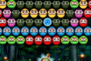 Filas de esferas de colores con caras dibujadas y un engranaje azul en el centro en un entorno de videojuego