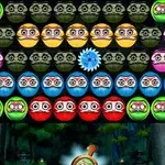 Filas de esferas de colores con caras dibujadas y un engranaje azul en el centro en un entorno de videojuego