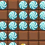 Caramelos de menta azul y blanco sobre un fondo de cuadrados de chocolate