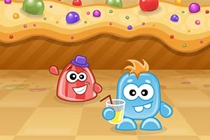 Dos personajes animados y coloridos sobre un suelo de cuadros, uno rojo con sombrero y otro azul con vaso de limonada, frente a un fondo de caramelo decorado con dulces
