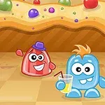 Dos personajes animados y coloridos sobre un suelo de cuadros, uno rojo con sombrero y otro azul con vaso de limonada, frente a un fondo de caramelo decorado con dulces