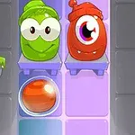 Dos personajes caricaturescos, uno verde y otro rojo, con una esfera anaranjada debajo, sobre un fondo morado y azul