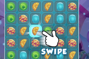 Interfaz de juego de rompecabezas con piezas de caramelo y una mano señalando un croissant, acompañado de la palabra SWIPE