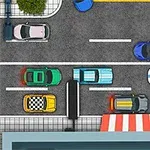 Vista aérea de una calle con varios autos de diferentes colores en movimiento y estacionados, junto a un edificio con toldo rojo y blanco
