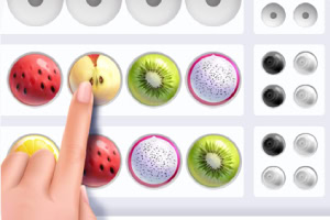 Una mano señala una serie de frutas organizadas en filas, incluyendo manzana, kiwi y fruta del dragón, con círculos blancos y negros al lado