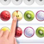 Una mano señala una serie de frutas organizadas en filas, incluyendo manzana, kiwi y fruta del dragón, con círculos blancos y negros al lado