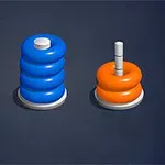 Tres postes con discos apilados donde un poste tiene cuatro discos azules, y los otros dos tienen dos discos naranjas cada uno, sobre un fondo oscuro