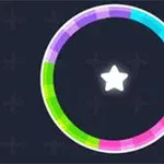 Círculo multicolor con patrón de arco iris que rodea una estrella blanca en el centro sobre un fondo oscuro