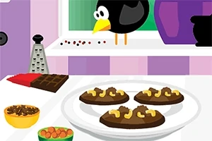 Plato de postres de chocolate en una cocina con utensilios y un cuervo en la ventana