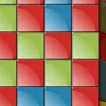 Cuadrícula de bloques de colores azul, rojo y verde con un brillo en cada uno