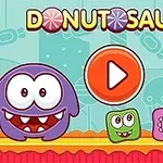 Ilustración de un personaje redondo y sonriente junto a bloques de colores con caras en un fondo colorido; un botón de play naranja está al centro