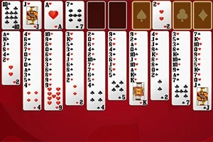 Juego de cartas solitario en un fondo rojo con cartas descubiertas en varias columnas y espacios para colocar más cartas en la parte superior