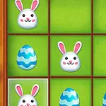 Conejitos y huevos de Pascua azules en un tablero de cuadrículas verdes