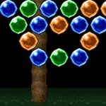 Esferas de colores azul, verde y naranja alineadas sobre un fondo oscuro con dos pilares marrones