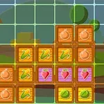 Bloques coloridos con imágenes de vegetales y frutas sobre un fondo que incluye un granero y un paisaje de colinas