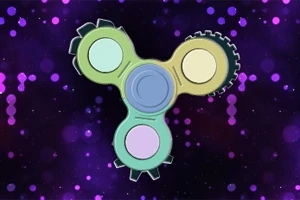 Un spinner con engranajes de colores sobre un fondo púrpura con puntos brillantes