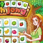 Silueta de mujer pelirroja junto a cartas con dibujos de frutas coloridas y fondo de bosque verde