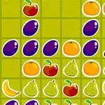 Frutas coloridas como cerezas, plátanos, peras y ciruelas en una cuadrícula verde