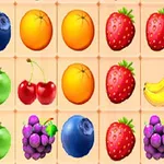 Frutas coloridas dispuestas en una cuadrícula, incluyendo fresas, naranjas, arándanos, cerezas, uvas, manzanas y plátanos