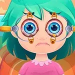 Niña de cabello verde con un dispositivo oftalmológico manteniendo sus ojos abiertos