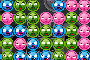 Caras de monstruos en círculos de colores verde, azul y rosa con expresiones de enojo y sorpresa