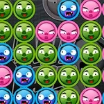 Caras de monstruos en círculos de colores verde, azul y rosa con expresiones de enojo y sorpresa