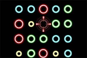 Círculos de colores brillantes dispuestos en una cuadrícula sobre un fondo negro