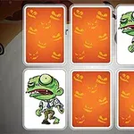 Cinco cartas con dorso de calabazas naranjas, dos mostrando un zombi verde