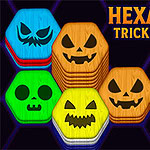 Hexa Sort Trick or Treat Bloques hexagonales de colores con caras de calabazas y una mano monstruosa apuntando en un fondo oscuro