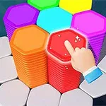 Mano señalando un bloque hexagonal rojo brillante sobre una pila de bloques de colores