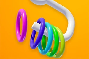 Anillos de colores brillantes en un tubo blanco sobre un fondo amarillo