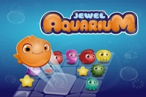 Un pez anaranjado sonriente mueve piezas de colores brillantes sobre un fondo azul con el texto Jewel Aquarium