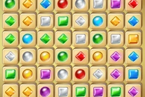 Una cuadrícula llena de joyas de colores con formas variadas sobre un fondo beige
