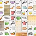 Iconos de utensilios de cocina y alimentos organizados en una cuadrícula contra un fondo borroso