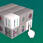 Cubo formado por piezas con motivos de fichas tradicionales y una mano señalando una de ellas