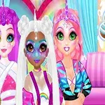 Tres chicas con maquillaje colorido y peinados de unicornio posan juntas frente a un fondo brillante y colorido