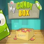 Personaje verde sonriente junto a una caja de caramelos en un entorno colorido con el título My Candy Box